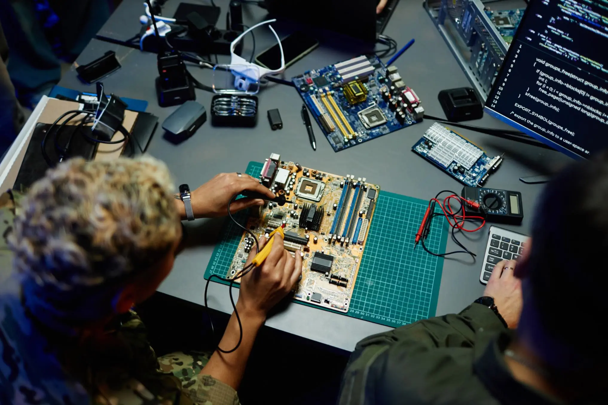 Person working on electronic components