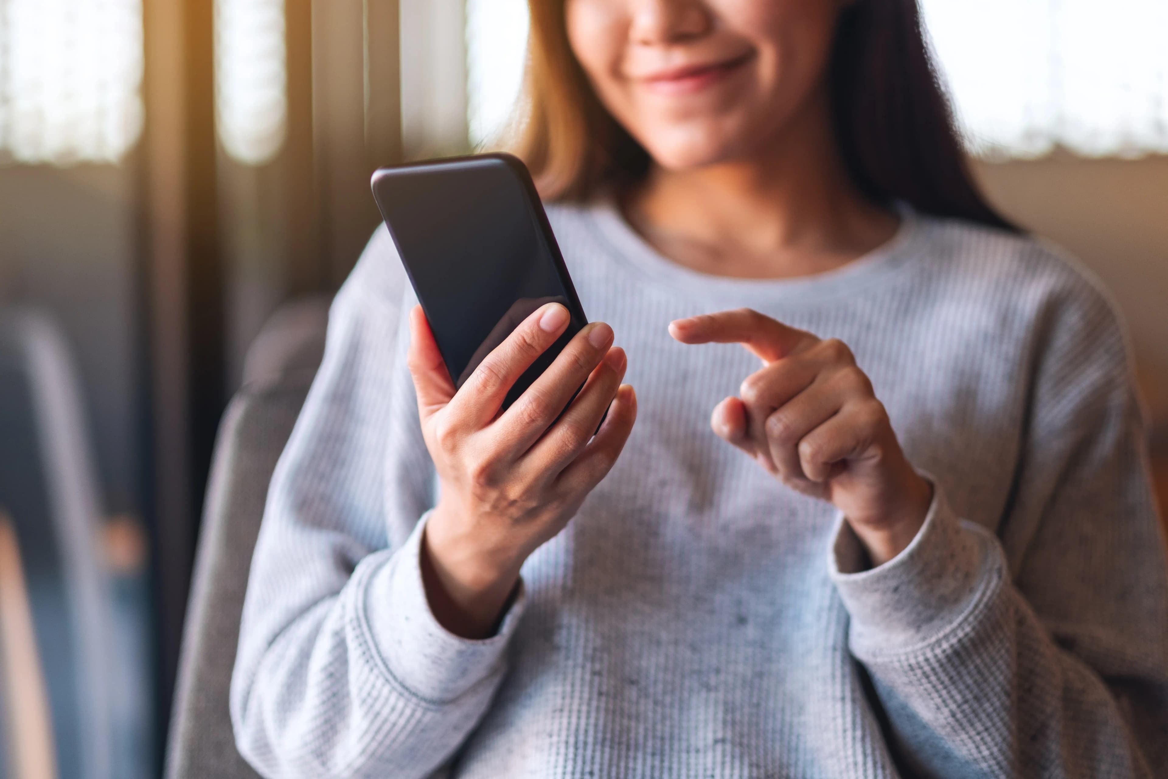 Person checking shipment on phone